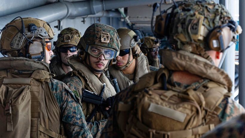 USA
This image from video provided by U.S. Central Command shows U.S. Sailors and Marines aboard USS Tripoli (LHA 7) arriving in the U.S. Central Command area of responsibility, March 27, 2026. (U.S. Central Command via AP) NYPS201
