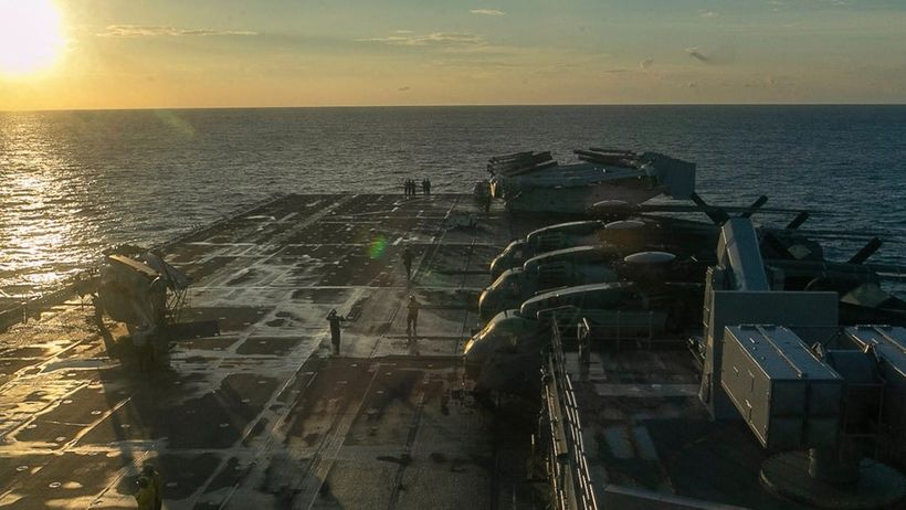 This image from video provided by U.S. Central Command shows U.S. Sailors and Marines aboard USS Tripoli arriving in the U.S. Central Command area of responsibility, March 27, 2026. (U.S. Central Command via AP) NYPS202