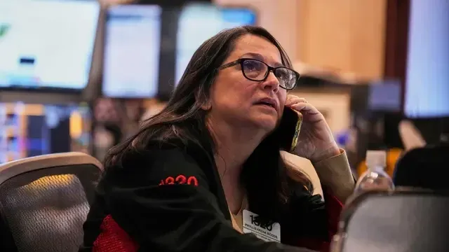 Trader Phyllis Arena Woods works on the floor of the New York Stock Exchange, Tuesday, May 6, 2025. (AP Photo/Richard Drew) NYRD210

