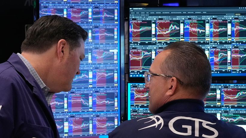 Trader Terrance McCauley, left, and specialist Anthony Matesic confer on the floor of the New York Stock Exchange, Monday, April 20, 2026. (AP Photo/Richard Drew) NYRD111