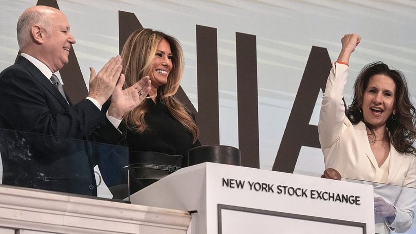 First lady Melania Trump, center, is flanked by Chairperson of Intercontinental Exchange Jeffrey Sprecher, left, and NYSE President Lynn Martin as she rings the opening bell of the New York Stock Exchange, Wednesday, Jan. 28, 2026. (AP Photo/Richard)