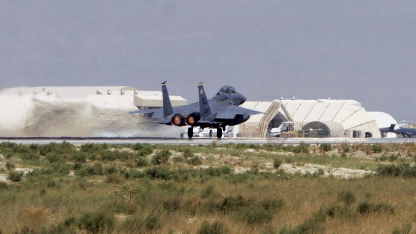 A U.S. F-15E Strike Eagle fighter jet runs on run way to take off, marking the anniversary of the Sept. 11, 2001 attacks, at the main U.S. base in Bagram, north of Kabul, Afghanistan, Friday, Sept. 11, 2009. (AP Photo/Musadeq Sadeq)
