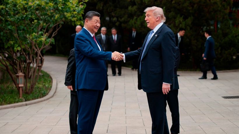 U.S. President Donald Trump, right, shakes hands with Chinese President Xi Jinping while leaving after a visit to the Zhongnanhai Garden in Beijing, Friday, May 15, 2026. (Evan Vucci/Pool Photo via AP) ELM104


