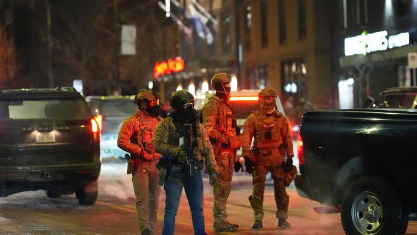 Federala agenter i Minneapolis i samband med en demonstration på söndagen.